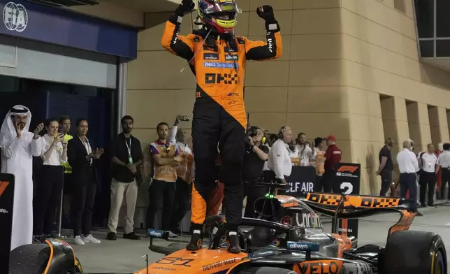 McLaren driver Oscar Piastri of Australia celebrates after winning the the Formula One Bahrain Grand Prix, in Sakhir, Sunday, April 13, 2025. (AP Photo/Altaf Qadri)