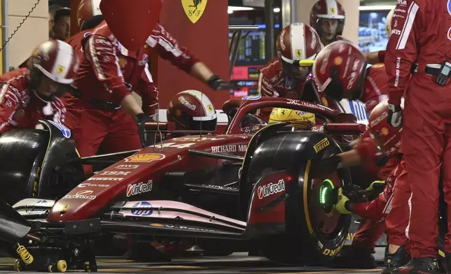 Ferrari driver Lewis Hamilton of Britain makes a pit stop during the Formula One Bahrain Grand Prix at Sakhir circuit, Sunday, April 13, 2025. (Andrej Isakovic Pool via AP)