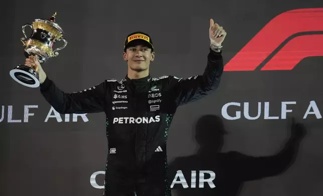 Mercedes driver George Russell of Britain celebrates second place at the the Formula One Bahrain Grand Prix, in Sakhir, Sunday, April 13, 2025. (AP Photo/Altaf Qadri)