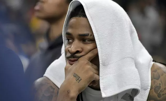Memphis Grizzlies guard Ja Morant looks on from the bench in the first half of Game 3 of an NBA first-round playoff series against the Oklahoma City Thunder, Thursday, April 24, 2025, in Memphis, Tenn. (AP Photo/Brandon Dill)