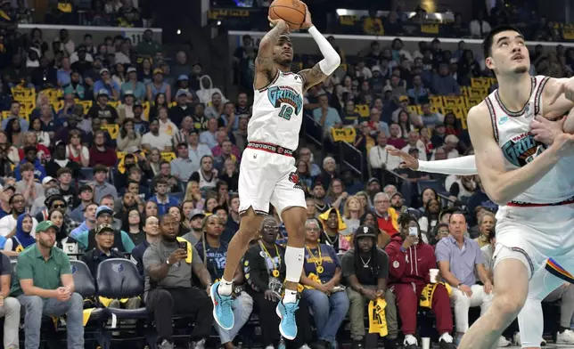 Memphis Grizzlies guard Ja Morant (12) shoots against the Oklahoma City Thunder in the first half of Game 3 of an NBA first-round playoff series Thursday, April 24, 2025, in Memphis, Tenn. (AP Photo/Brandon Dill)