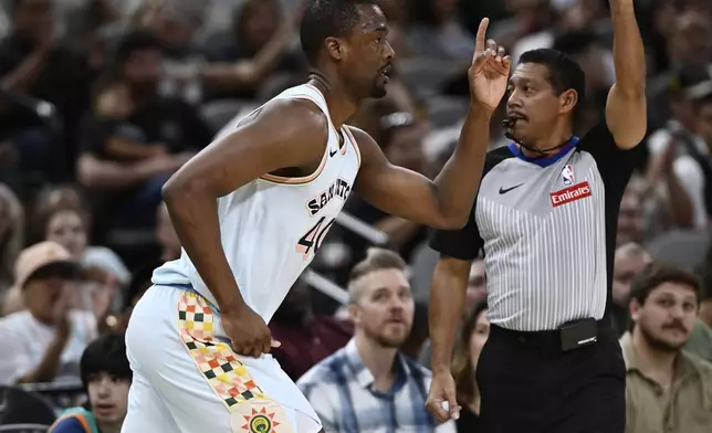 San Antonio Spurs forward Harrison Barnes (40) celebrates a 3-point basket during the first half of an NBA basketball game against the Toronto Raptors, Sunday, April 13, 2025, in San Antonio. (AP Photo/Darren Abate)