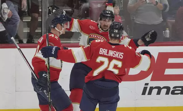 Florida Panthers center Brad Marchand (63) celebrates his goal during the second period of an NHL hockey game against the Detroit Red Wings, Thursday, April 10, 2025, in Sunrise, Fla. (AP Photo/Marta Lavandier)