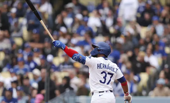 Los Angeles Dodgers' Teoscar Hernández watches his home run during the fifth inning of a baseball game against the Pittsburgh Pirates in Los Angeles, Sunday, April 27, 2025. (AP Photo/Jessie Alcheh)