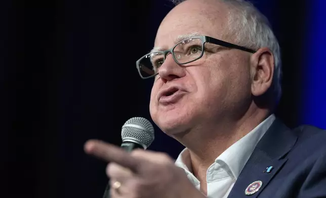 FILE - Minnesota Gov. Tim Walz speaks at a town hall event at Roosevelt High School, Friday, March 14, 2025, in Des Moines, Iowa. (AP Photo/Matthew Putney,File)