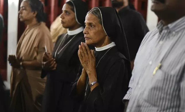 Indian Catholics pray during a prayer meeting for Pope Francis in Kochi, India, Monday, April 21, 2025. (AP Photo/R S Iyer)