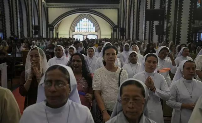 Myanmar Christians attend a prayer for Pope Francis at St. Mary Cathedral Tuesday, April 22, 2025, in Yangon, Myanmar. (AP Photo/Thein Zaw)