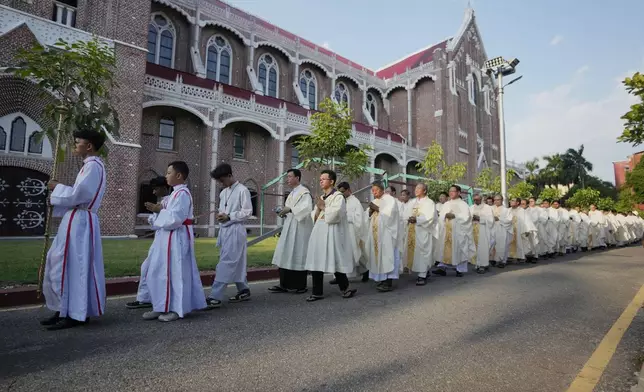 Christian priests attend a prayer for Pope Francis at St. Mary Cathedral Tuesday, April 22, 2025, in Yangon, Myanmar. (AP Photo/Thein Zaw)