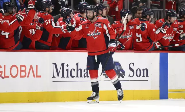 Washington Capitals right wing Tom Wilson (43) celebrates his goal during the second period of an NHL hockey game against the Carolina Hurricanes, Thursday, April 10, 2025, in Washington. (AP Photo/Nick Wass)