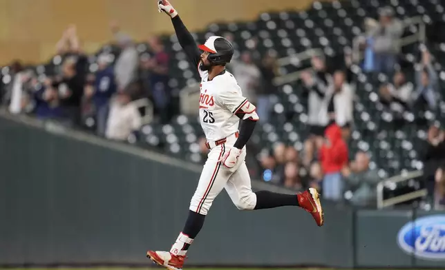 Minnesota Twins' Byron Buxton (25) runs the bases after hitting a 2-run home run during the seventh inning of a baseball game against the Chicago White Sox, Wednesday, April 23, 2025, in Minneapolis. (AP Photo/Abbie Parr)
