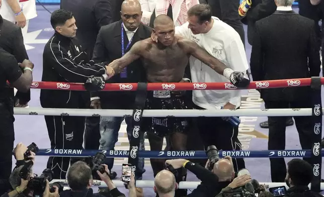 Conor Benn appears dejected after losing a middleweight bout against Chris Eubank Jr. at Tottenham Hotspur Stadium, London, Saturday, April 26, 2025. (Bradley Collyer/PA via AP)