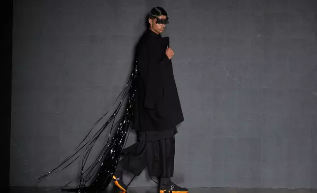 A model wears a creation from the Leandro Castro collection at Sao Paulo Fashion Week, Tuesday, April 8, 2025. (AP Photo/Andre Penner)