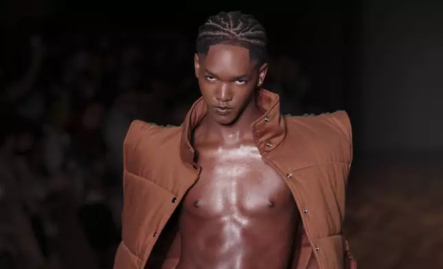 A model wears a creation from the Dendezeiro collection during Sao Paulo Fashion Week, in Sao Paulo, Thursday, April 10, 2025. (AP Photo/Ettore Chiereguini)