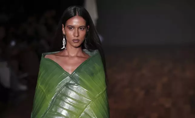 A model wears a creation from the Dendezeiro collection during Sao Paulo Fashion Week, in Sao Paulo, Thursday, April 10, 2025. (AP Photo/Ettore Chiereguini)