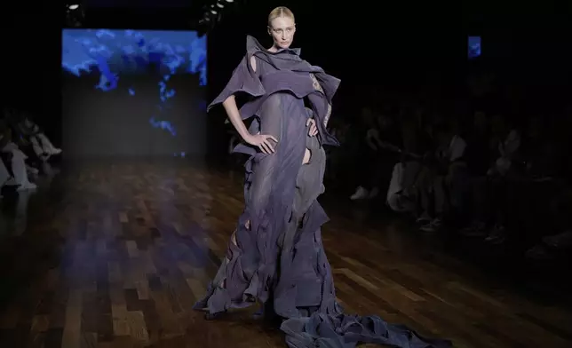 A model wears a creation from the Lino Villaventura collection during Sao Paulo Fashion Week, Tuesday, April 8, 2025. (AP Photo/Andre Penner)