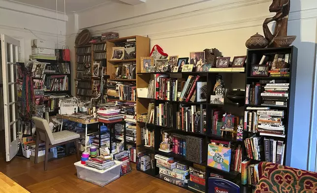 A cluttered living room appears in New York on Tuesday, April 8, 2025. (AP Photo/Leanne Italie)