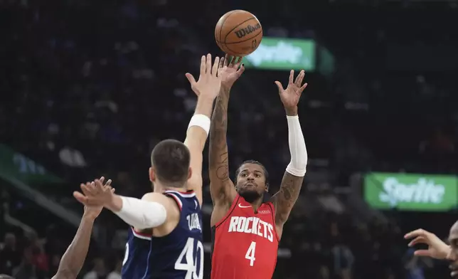 Houston Rockets guard Jalen Green, right, shoots as Los Angeles Clippers center Ivica Zubac defends during the first half of an NBA basketball game Wednesday, April 9, 2025, in Inglewood, Calif. (AP Photo/Mark J. Terrill)