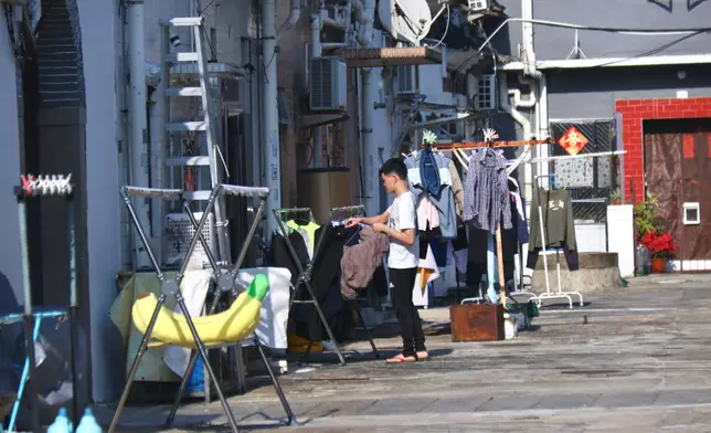 The courtyard inside the Tsang Tai House. Residents use the open space to dry their clothes. Source: BP