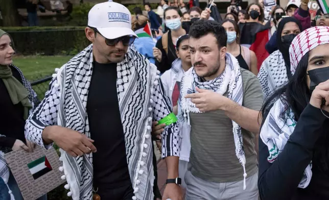 Mohsen Mahdawi, left, and Mahmoud Khalil participate in a pro-Palestinian protest at Columbia University, Thursday, Oct. 12, 2023, in New York. (AP Photo/Yuki Iwamura)