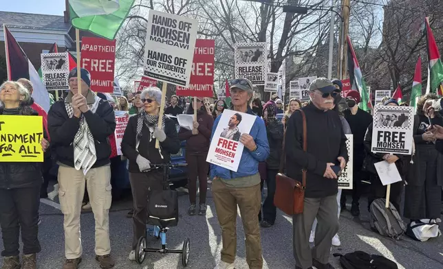 Protesters gather outside federal court ahead of a hearing for Mohsen Mahdawi, a Palestinian man arrested at a Vermont immigration office during an interview about finalizing his U.S. citizenship and a legal permanent resident who led protests against the war in Gaza at Columbia University, Wednesday, April 23, 2025 in Burlington, Vt. (AP Photo/Amanda Swinhart)