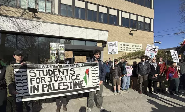 Protesters gather outside federal court ahead of a hearing for Mohsen Mahdawi, a Palestinian man arrested at a Vermont immigration office during an interview about finalizing his U.S. citizenship and a legal permanent resident who led protests against the war in Gaza at Columbia University, Wednesday, April 23, 2025 in Burlington, Vt. (AP Photo/Amanda Swinhart)