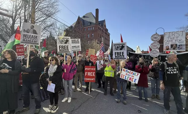 Protesters gather outside federal court ahead of a hearing for Mohsen Mahdawi, a Palestinian man arrested at a Vermont immigration office during an interview about finalizing his U.S. citizenship and a legal permanent resident who led protests against the war in Gaza at Columbia University, Wednesday, April 23, 2025 in Burlington, Vt. (AP Photo/Amanda Swinhart)
