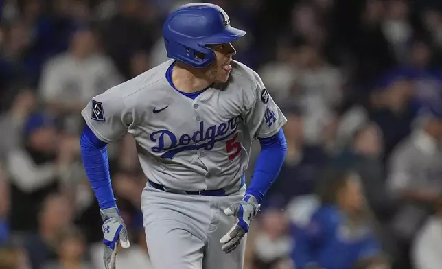Los Angeles Dodgers' Freddie Freeman (5) runs the bases on a double during the seventh inning of a baseball game against the Chicago Cubs, Tuesday, April 22, 2025, in Chicago. (AP Photo/Erin Hooley)