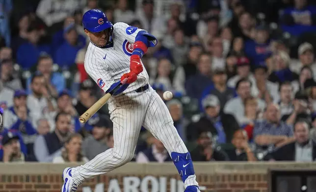 Chicago Cubs' Miguel Amaya (9) hits a game-tying home run during the ninth inning of a baseball game against the Los Angeles Dodgers, Tuesday, April 22, 2025, in Chicago. (AP Photo/Erin Hooley)