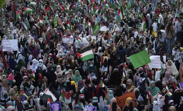 Supporters of the Pakistani religious group "Jamaat-e-Islami" take part in a rally against Israeli airstrikes and to show solidarity with Palestinian people living in Gaza, in Lahore, Pakistan Friday, April 11, 2025. (AP Photo/K.M. Chaudary)