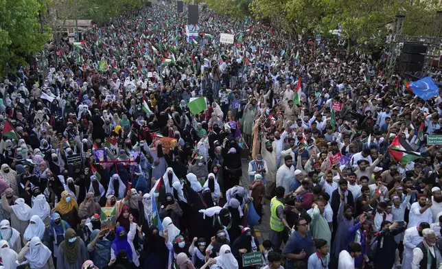 Supporters of the Pakistani religious group "Jamaat-e-Islami" take part in a rally against Israeli airstrikes and to show solidarity with Palestinian people living in Gaza, in Lahore, Pakistan Friday, April 11, 2025. (AP Photo/K.M. Chaudary)