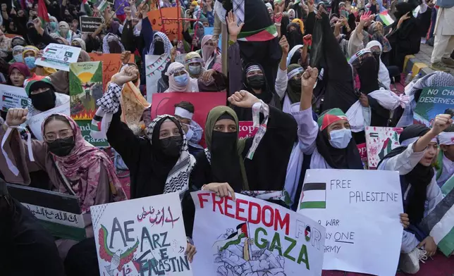 Supporters of the Pakistani religious group "Jamaat-e-Islami" take part in a rally against Israeli airstrikes and to show solidarity with Palestinian people living in Gaza, in Lahore, Pakistan Friday, April 11, 2025. (AP Photo/K.M. Chaudary)