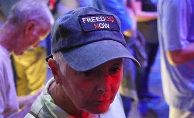 Laura Stillman, 75, of Raleigh, N.C., attends a Democratic town hall at the Haw River Ball Room in Saxapahaw, N.C., Thursday, April 24, 2025. (AP Photo/Allen G. Breed)