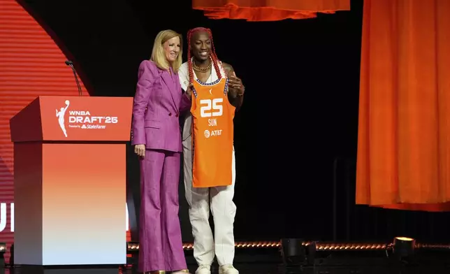 North Carolina State's Saniya Rivers, right, poses with WNBA commissioner Cathy Engelbert after being selected eighth overall by the Connecticut Sun during the first round of the WNBA basketball draft, Monday, April 14, 2025, in New York. (AP Photo/Pamela Smith)