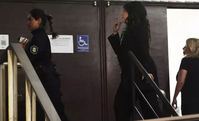 Dalma Maradona, a daughter of the late soccer star Diego Maradona, enters court in San Isidro, on the outskirts of Buenos Aires, Argentina, Tuesday, April 15, 2025, for a trial over allegations of homicide by negligence against the medical team that treated her father. (AP Photo/Emmanuel Fernandez)