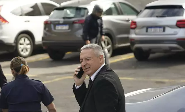 Victor Stinfale, former friend and lawyer of the late soccer star Diego Maradona, leaves court in San Isidro, on the outskirts of Buenos Aires, Argentina, Tuesday, April 15, 2025, after speaking at a trial of the medical team that treated Maradona which face charges of homicide by negligence. (AP Photo/Emmanuel Fernandez)