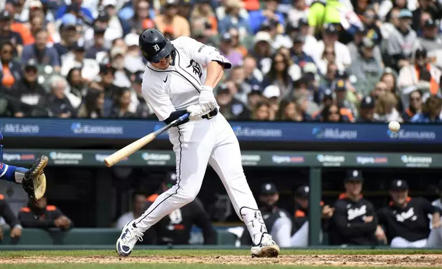 Detroit Tigers' Spencer Torkelson hits a three-run home run off Kansas City Royals starting pitcher Seth Lugo during the fifth inning of a baseball game, Saturday, April 19, 2025, in Detroit. (AP Photo/Jose Juarez)