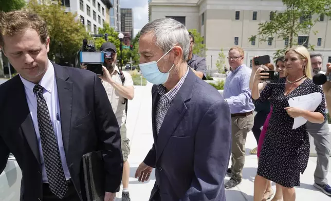 FILE - Former Tennessee House Speaker Glen Casada, center, gets into a car as he leaves the Federal Courthouse Aug. 23, 2022, in Nashville, Tenn. (AP Photo/Mark Humphrey)