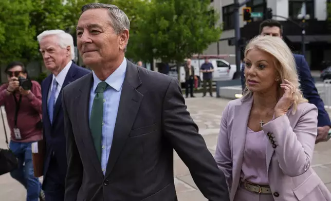 Former Tennessee House Speaker Glen Casada, center, arrives at the federal courthouse Tuesday, April 22, 2025, in Nashville, Tenn. (AP Photo/George Walker IV)