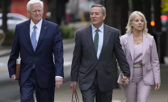 Former Tennessee House Speaker Glen Casada, center, arrives at the federal courthouse Tuesday, April 22, 2025, in Nashville, Tenn. (AP Photo/George Walker IV)