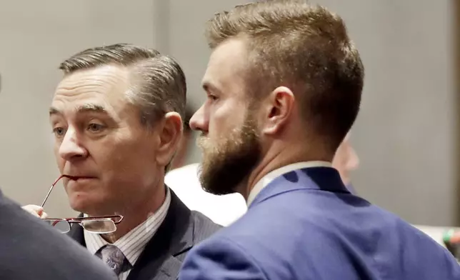 FILE - In this May 2, 2019, file photo, House Speaker Glen Casada, R-Franklin, left, talks with Cade Cothren, right, his chief of staff, during a House session in Nashville, Tenn. (AP Photo/Mark Humphrey, File)