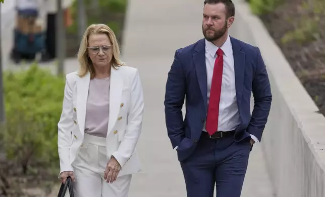 Cade Cothren, the former chief of staff to former Tennessee House Speaker Glen Casada, right, arrives at the federal courthouse with his attorney Cynthia Sherwood, right, Tuesday, April 22, 2025, in Nashville, Tenn. (AP Photo/George Walker IV)