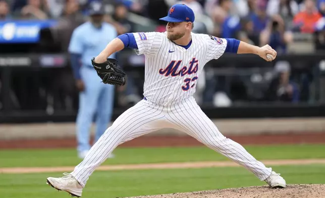 New York Mets pitcher A.J. Minter (33) throws during the seventh inning of a baseball game against the Toronto Blue Jays, Friday, April 4, 2025, in New York. (AP Photo/Julia Demaree Nikhinson)