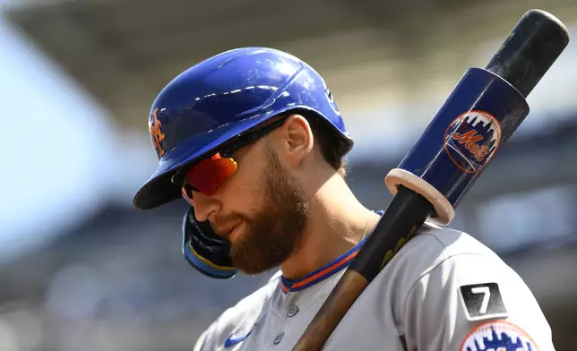 New York Mets' Brandon Nimmo stands on deck during the first inning of a baseball game against the Washington Nationals, Sunday, April 27, 2025, in Washington. (AP Photo/Nick Wass)