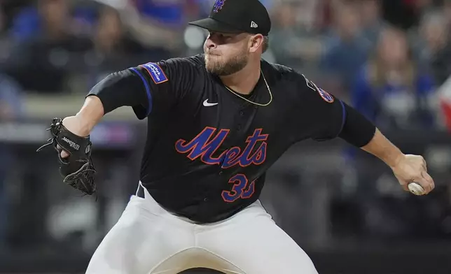 New York Mets' A.J. Minter pitches during the seventh inning of a baseball game against the Philadelphia Phillies Tuesday, April 22, 2025, in New York. (AP Photo/Frank Franklin II)