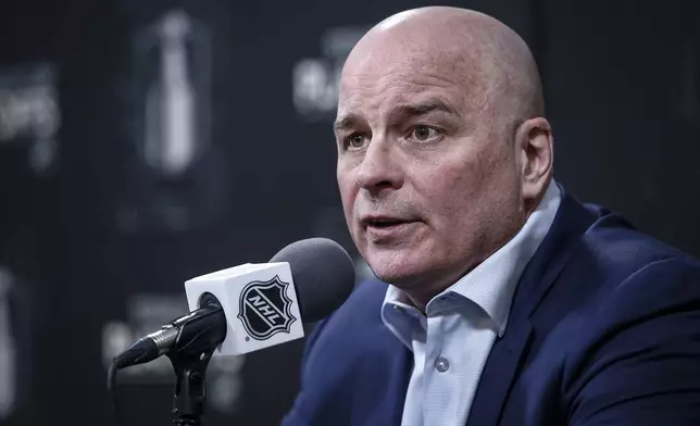 St. Louis Blues head coach Jim Montgomery talks to media at a post NHL round one playoff game press conference in Winnipeg on Saturday, April 19, 2025. (John Woods/The Canadian Press via AP)