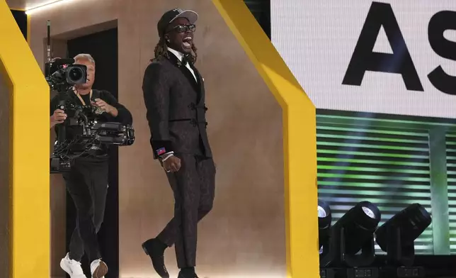 Boise State running back Ashton Jeanty celebrates after being chosen by the Las Vegas Raiders with the sixth overall pick during the first round of the NFL football draft, Thursday, April 24, 2025, in Green Bay, Wis. (AP Photo/Jeff Roberson)