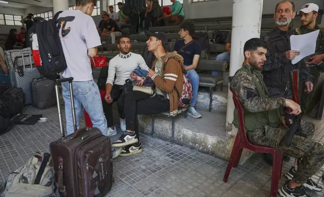 Druze students who fled their dorms at Damascus University arrive to take shelter in Jaramana suburb, a day after clashes between members of the minority Druze sect and pro-government fighters left at least four people dead in the southern suburb of Jaramana, Damascus, Syria, Tuesday, April 29, 2025. (AP Photo/Omar Sanadiki)