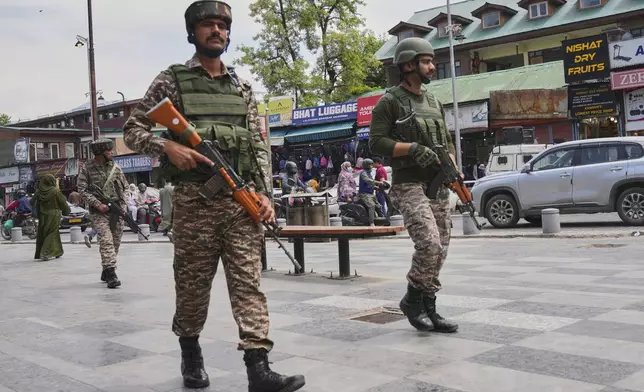 Indian paramilitary soldiers patrol a busy market in Srinagar, Indian controlled Kashmir, Thursday, April 24, 2025. (AP Photo/Dar Yasin)