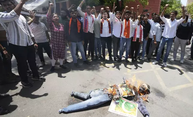 Supporters of Akhil Bharatiya Vidhyarthi Parishad, or All India Students' Council burn an effigy of terrorism and shouts slogans during a protest against the killing of tourists by militants near Pahalgam in Indian controlled Kashmir, in Ahmedabad, India, Thursday, April 24, 2025. (AP Photo/Ajit Solanki)
