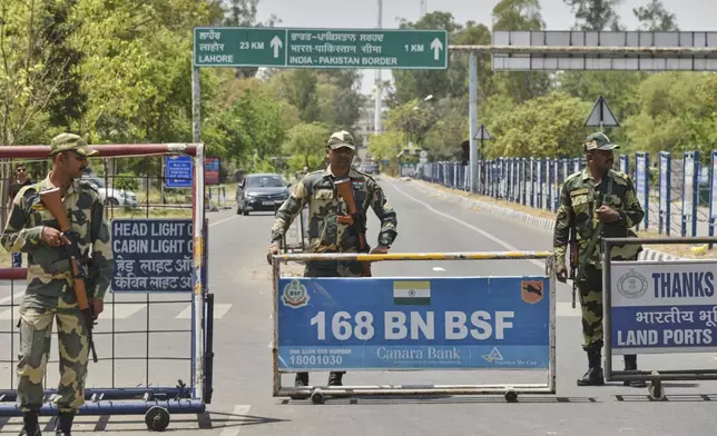 Indian Border Security Force soldiers stand guard at the barricade on the road leading to the Attari-Wagah border on India's side, near Amritsar, Thursday, April 24, 2025. (AP Photo/Prabhjot Gill)